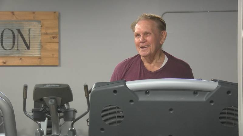 Harlond Womack, 95, sings a country tune as he walks on the treadmill at Fitness Connection in...