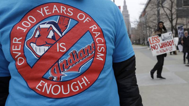 A man wears a shirt in protest of Chief Wahoo before a home opener baseball game between the...