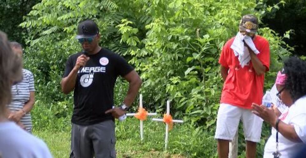 A man says a prayer at a location where two lost their lives. (source: Mike Mohundro, KFVS)