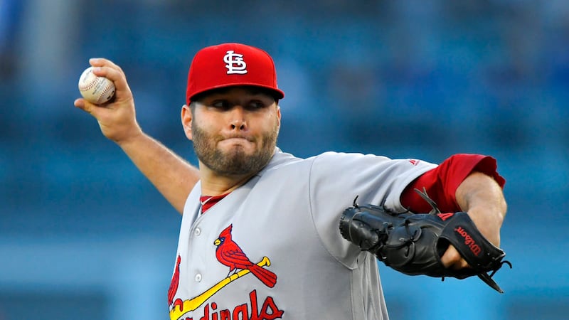 St. Louis Cardinals starting pitcher Lance Lynn throws to the plate during the first inning of...