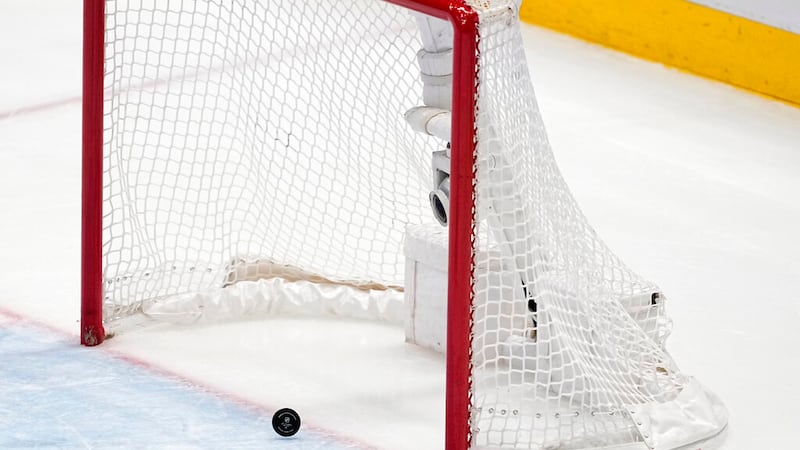 The puck crosses the line into the net on an empty net goal scored by Toronto Maple Leafs'...