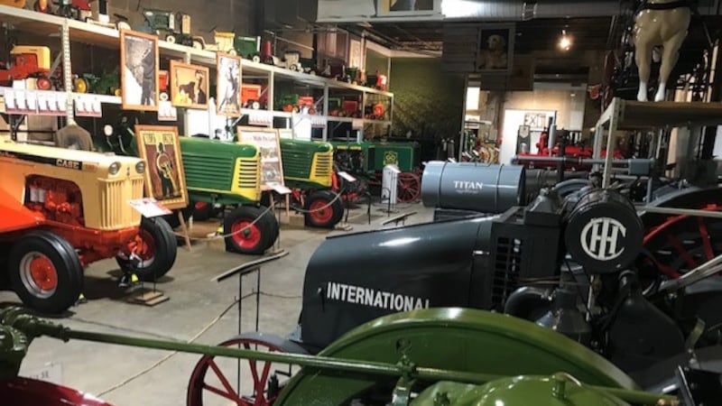 Tractors are lined up inside the new American Tractor Museum in Perryville, Mo.