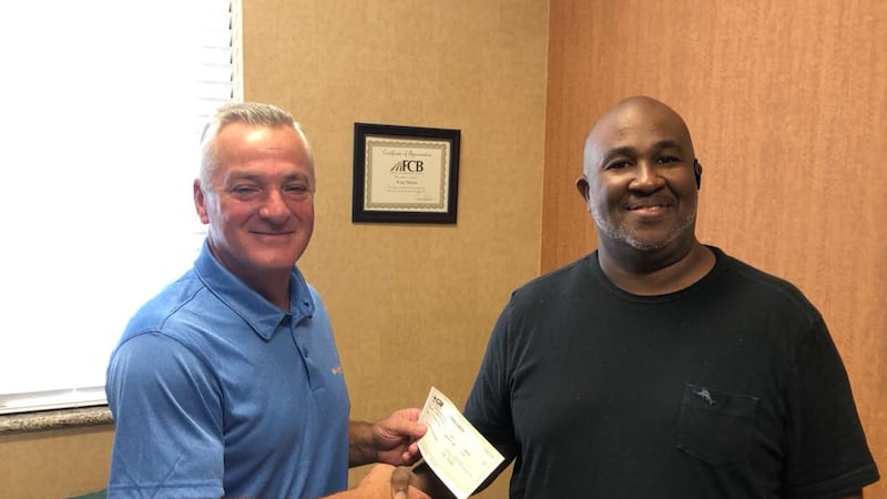 From left to right: Kreg Denton, IDA chair, and CEO of 3 Rivers Grocery Billy Ingram.