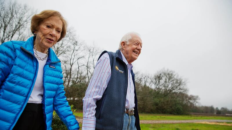 FILE - In this Feb. 8, 2017, photo, former President Jimmy Carter, right, and his wife...